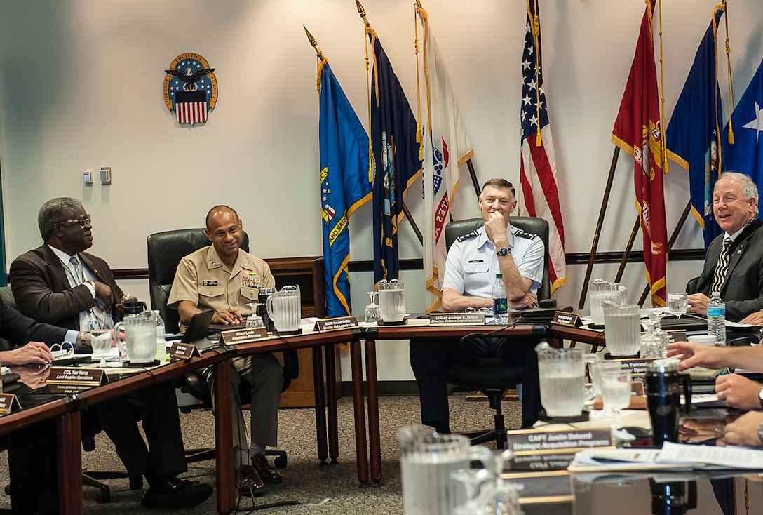 Leaders from DLA share a light moment during Land and Maritime’s Annual Operating Plan presentation Aug. 17 inside Building 20 at Defense Supply Center Columbus. DLA Director Air Force Lt. Gen. Andy Busch (third from left) was at DSCC with other DLA leaders to review the plan and assess performance initiatives and operating forecasts while offering his feedback. Pictured are (l-r): Milton Lewis, Land and Maritime’s acquisition executive; Navy Rear Adm. Vincent Griffith, DLA’s director of logistics operations; Busch; and James McClaugherty, Land and Maritime’s acting commander. 