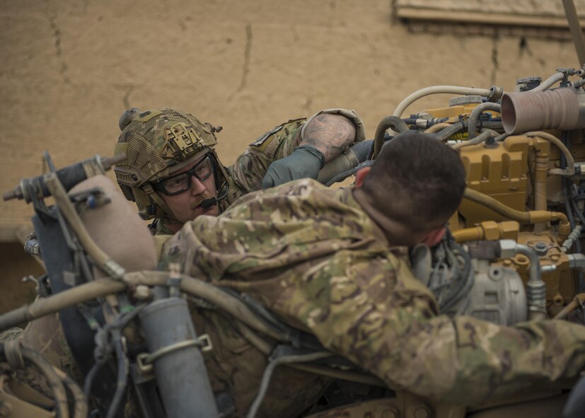 Senior Airman Austin Henson, 83rd Expeditionary Rescue Squadron pararescue specialist, attends to Senior Airman Russell Prisinki, 455th Expeditionary Logistic Readiness Squadron traffic management journeyman, during a joint mass casualty and extraction exercise, Bagram Airfield, Afghanistan, Aug. 18, 2016. Airmen from various units acted as wounded patients with injuries that included broken limbs, deliria and head injuries. (U.S. Air Force photo by Senior Airman Justyn M. Freeman)