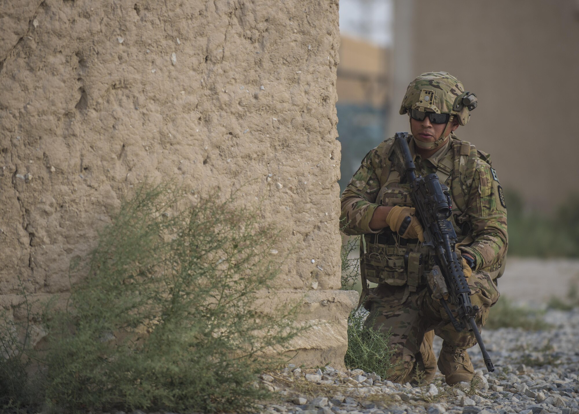 U.S. Army Spc. David Cruz, 717th Explosive Ordinance Disposal Unit, guards the perimeter during a mass casualty and extraction exercise with Airmen from the 83rd Expeditionary Rescue Squadron, Bagram Airfield, Afghanistan, Aug. 18, 2016. The joint exercise called on EOD to identify, remove and dispose of ordnance in the area and from crashed vehicles carrying explosives. (U.S. Air Force photo by Senior Airman Justyn M. Freeman)