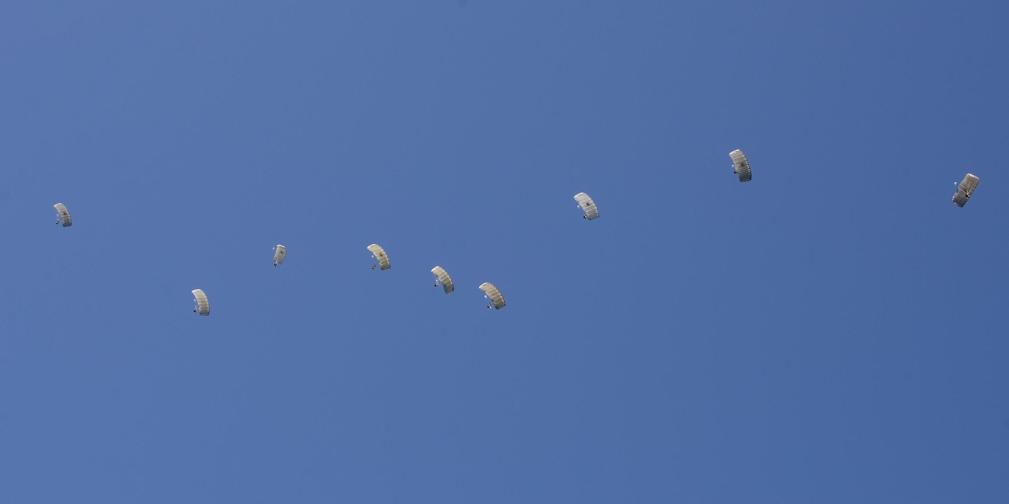 Pararescuemen from the 38th Rescue Squadron drift through the sky during a high-altitude, low-opening jump, Aug. 18, 2016, at Moody Air Force Base, Ga. Training jumps are typically conducted from 9,000 to 12,000 feet, but current deployed operations require an airdrop of 20,000 feet or more. (U.S. Air Force photo by Airman 1st Class Daniel Snider)