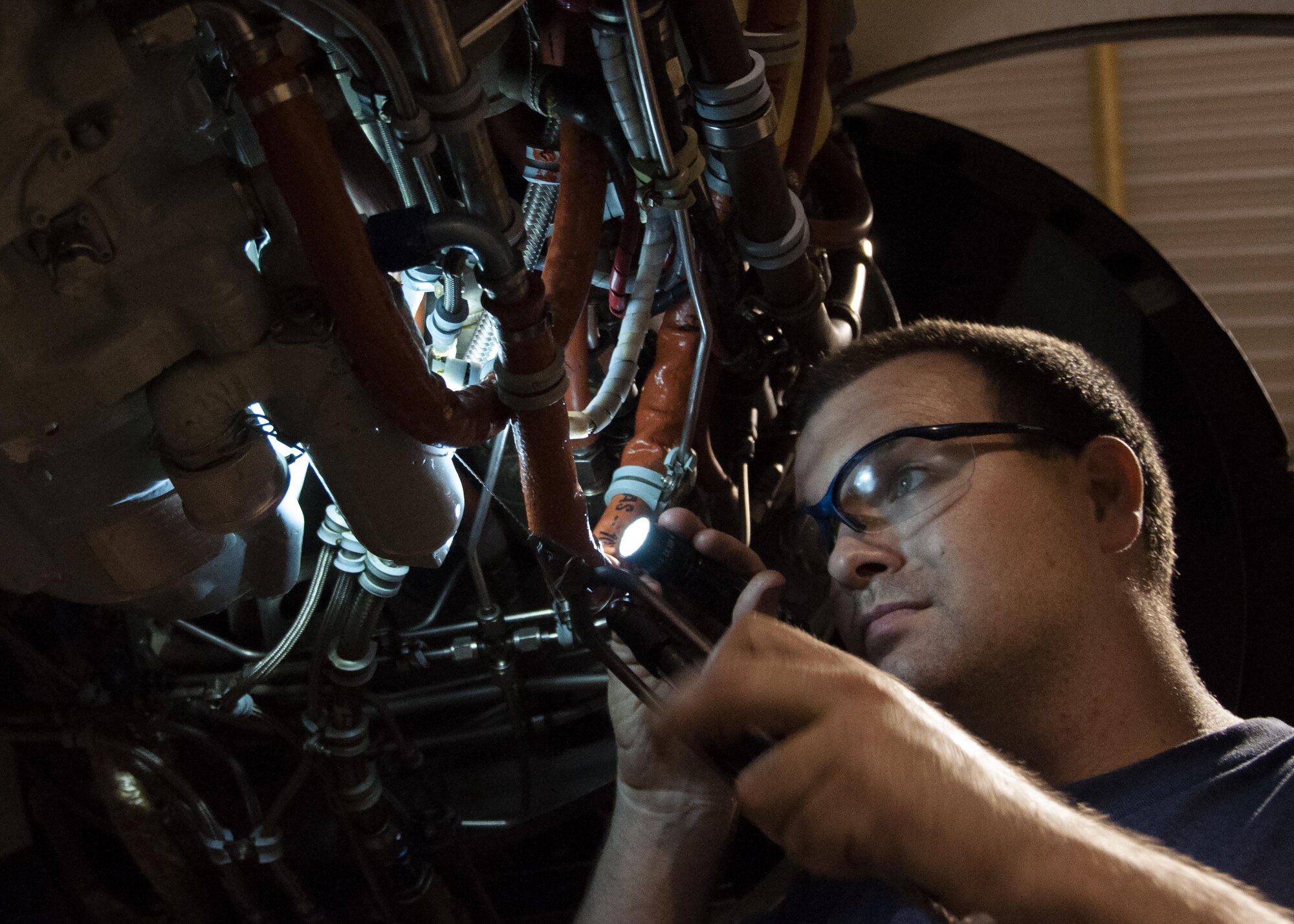 Tech. Sgt. Russell Roberts, a crew chief with the 442nd Maintenance Squadron, attaches a new integrated drive generator to the engine of an A-10 Thunderbolt II at Whiteman Air Force Base, Mo., Aug. 15, 2016. The maintenance crew found debris in the sight glass of the previous IDG, which caused the engine to lose power. (U.S. Air Force photo/Senior Airman Missy Sterling)