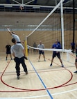 U.S. Air Force Senior Airman Randall Saylor, Airman Leadership School student, top left, prepares to spike a volleyball during a volleyball game at the Eifel Powerhouse on Spangdahlem Air Base, Germany, Aug. 17, 2016. Traditionally, Saber senior NCOs challenge ALS students at Spangdahlem to compete in a volleyball match in a friendly rivalry game.