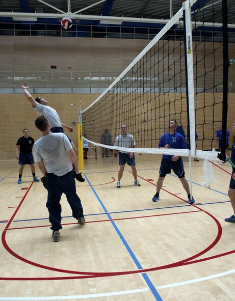 U.S. Air Force Senior Airman Randall Saylor, Airman Leadership School student, top left, prepares to spike a volleyball during a volleyball game at the Eifel Powerhouse on Spangdahlem Air Base, Germany, Aug. 17, 2016. Traditionally, Saber senior NCOs challenge ALS students at Spangdahlem to compete in a volleyball match in a friendly rivalry game.
