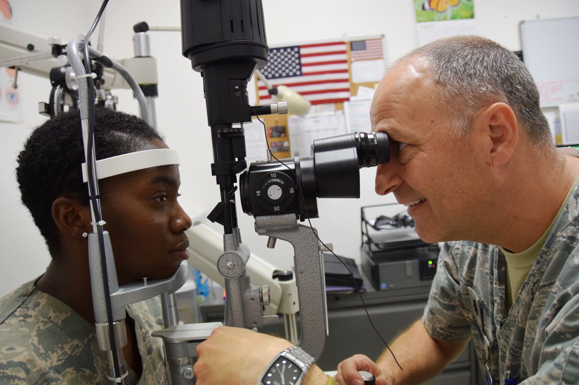 Lt. Col. Timothy Landis, an optometrist at the 379th Expeditionary Medical Operations Squadron, conducts an eye exam on Staff Sgt. Leonae Franklin, a dental technician at 379th EMDOS, Aug. 2, 2016, at Al Udeid Air Base, Qatar. An eye exam at the optometry clinic can identify vision problems; the clinic can then develop and implement an eye care plan to correct any issues. (U.S. Air Force photo/Technical Sgt. Carlos J. Treviño/Released)
