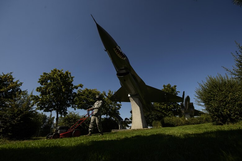 Staff Sgt. Edward Davis, 910th Force Support Squadron, Youngstown-Warren Air Reserve Station, Ohio, volunteers his time to help landscape the air park on Spangdahlem Air Base, Germany, Aug. 17, 2016. The park was opened in Sept. 1997 to allow base personnel to reflect on the history, honor and mission of past Saber team members. (U.S. Air Force photo by Staff Sgt. Jonathan Snyder)