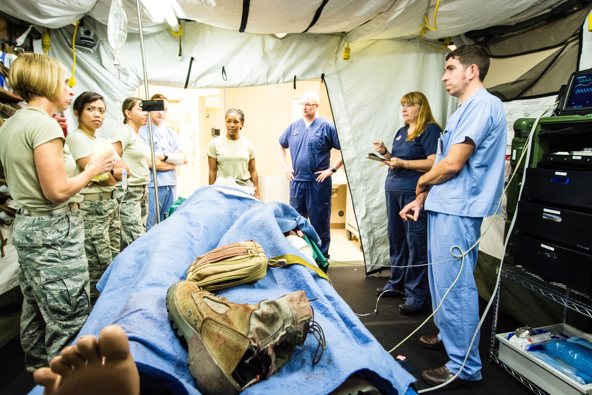 Reserve Airmen from the 512th Aerospace Medicine Squadron receive feedback after treating a simulated patient mannequin for multiple injuries during a field-training scenario July 29, 2016, Scottsdale, Arizona. 512th AMDS medical and dental technicians spent two weeks with HonorHealth Scottsdale's Military Partnership Program obtaining training and providing patient care while honing their skills in a civilian hospital setting. (U.S. Air Force photo/Lt. Steve Lewis)