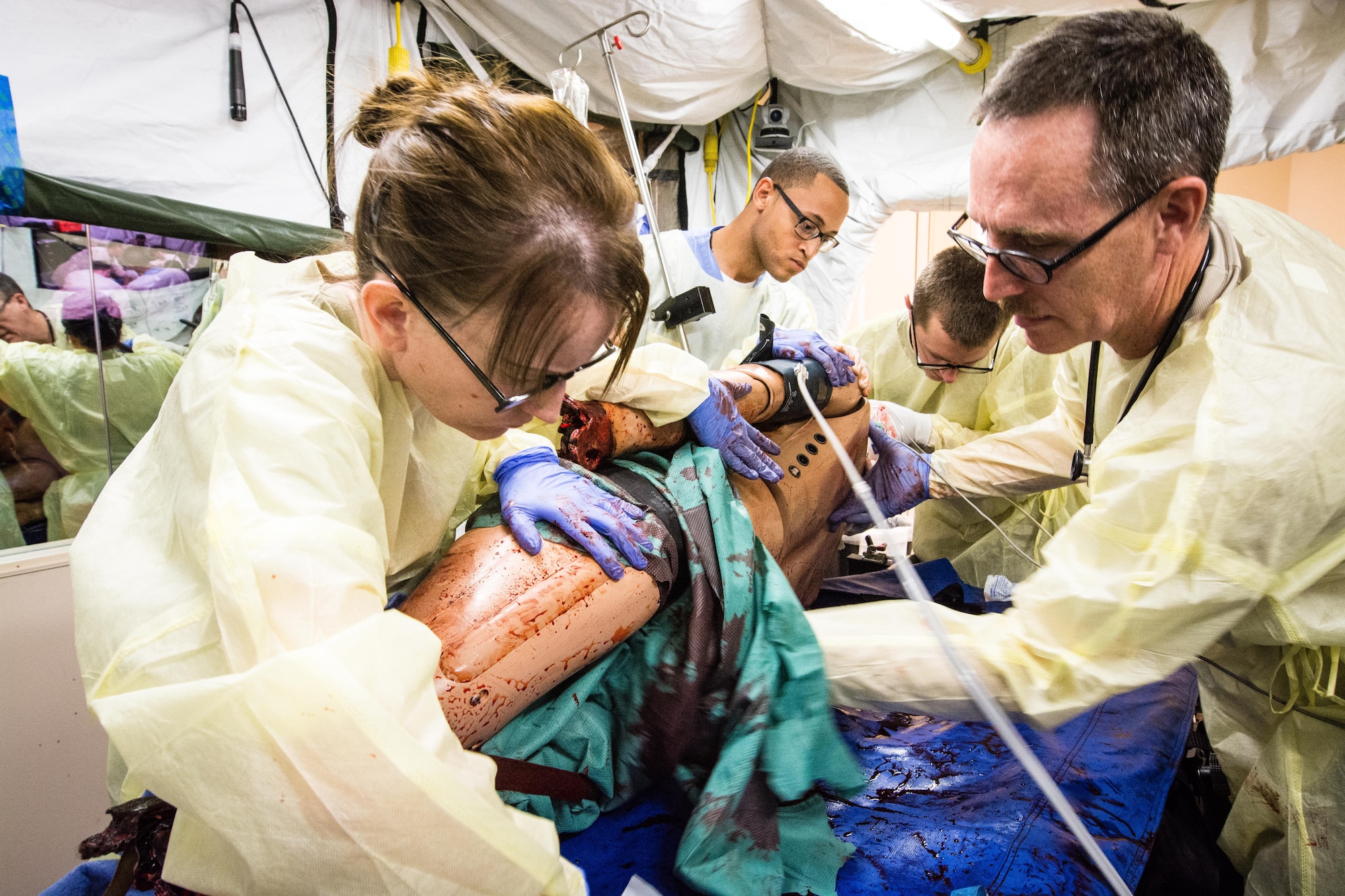 Reserve Airmen from the 512th Aerospace Medicine Squadron treat a simulated patient mannequin for multiple injuries during a field-training scenario July 29, 2016, Scottsdale, Arizona. 512th AMDS medical and dental technicians spent two weeks with HonorHealth Scottsdale's Military Partnership Program obtaining training and providing patient care while honing their skills in a civilian hospital setting. (U.S. Air Force photo/Lt Steve Lewis)