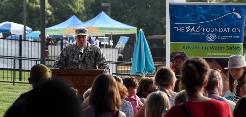 Col. William Kale III, 11th Mission Support Group commander, speaks at a swim camp event held at the base pool on Joint Base Andrews, Md., Aug. 16, 2016. The event had various guest speakers, including Danielle Hagen, Zac Foundation national spokeswoman, and Vincent Eure, 11th Force Support Squadron director of youth programs. The special guests spoke about the importance of safety around pools. (U.S. Air Force photo by Airman 1st Class Valentina Lopez)