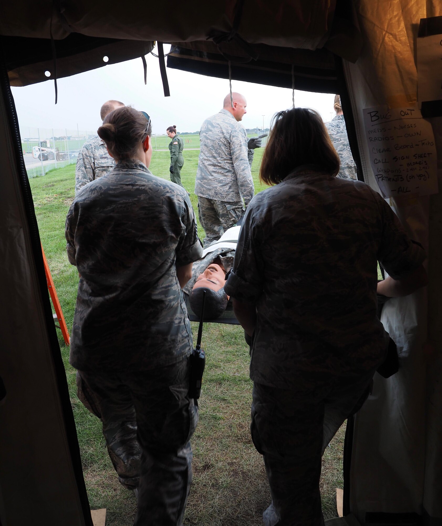 Members of the 911th Aeromedical Staging Squadron from Pittsburgh Air Reserve Station, Pa. transport "patients" from an En Route Patient Staging System 10 bed facility to a larger 50 patient facility. 