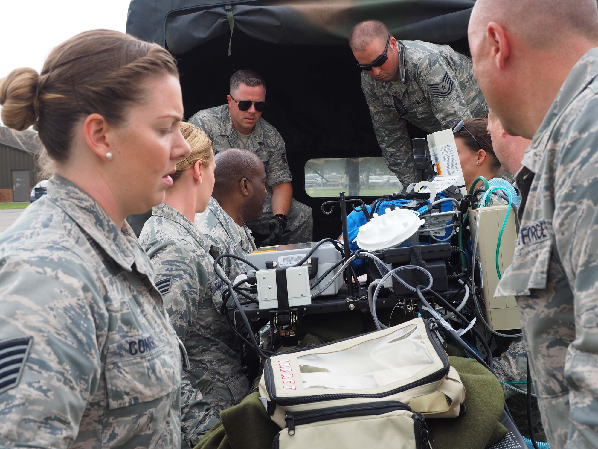Members of the 911th Aeromedical Staging Squadron from Pittsburgh Air Reserve Station, Pa. transport "patients" from an En Route Patient Staging System 10 bed facility to a larger 50 patient facility. 
