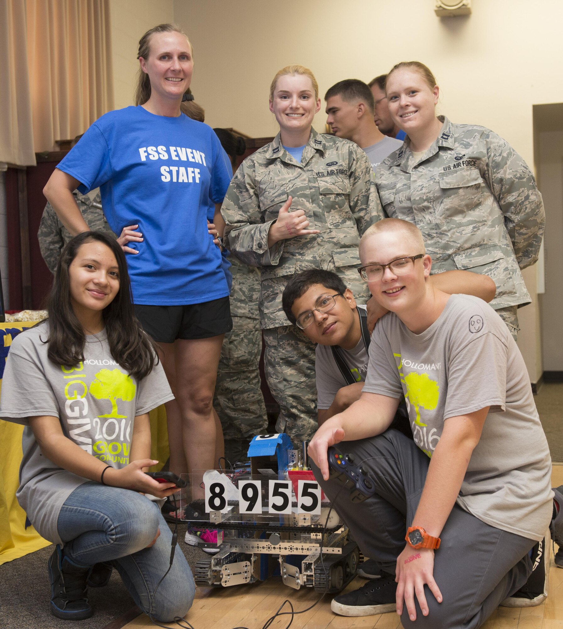 Members from team R2D2 pose with their robot during the Big Give after-party August 12, 2016 at Holloman Air Force Base, N.M. Over the course of three weeks, 32 teams of 412 participants spent nearly 5,000 man hours volunteering in the local community — saving the area $202,092.33. (Last names are being withheld due to operational requirements. U.S. Air Force photo by Airman 1st Class Randahl J. Jenson)
