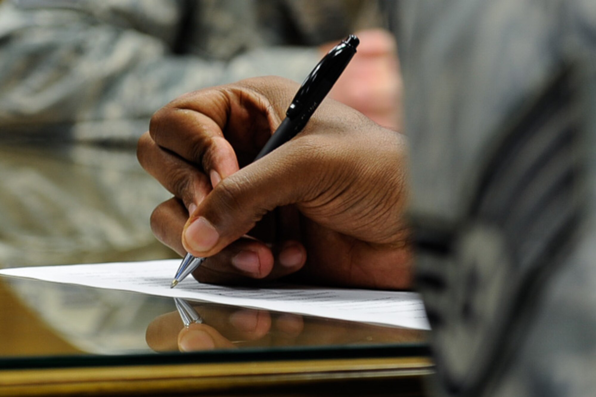 Staff Sgt. Trent Wilson, 1st Combat Communications Squadron radio frequency transmissions system supervisor, takes notes during a wing inspection team training July 18, 2016, at Ramstein Air Base, Germany. The training teaches the inspectors to look for quality within the safety, resource management, fiscal and personal management, and the morale of a unit.  (U.S. Air Force photo/ Airman 1st Class Savannah L. Waters)