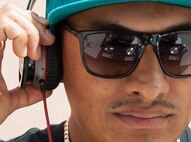 Staff Sgt. Israel Ortiz, 786th Civil Engineer Squadron structural supervisor, plays music during a party for families of deployed Airmen Aug. 12, 2016 at Ramstein Air Base, Germany. Approximately 200 people volunteered for the party. (U.S. Air Force photo/Airman 1st Class Lane T. Plummer)