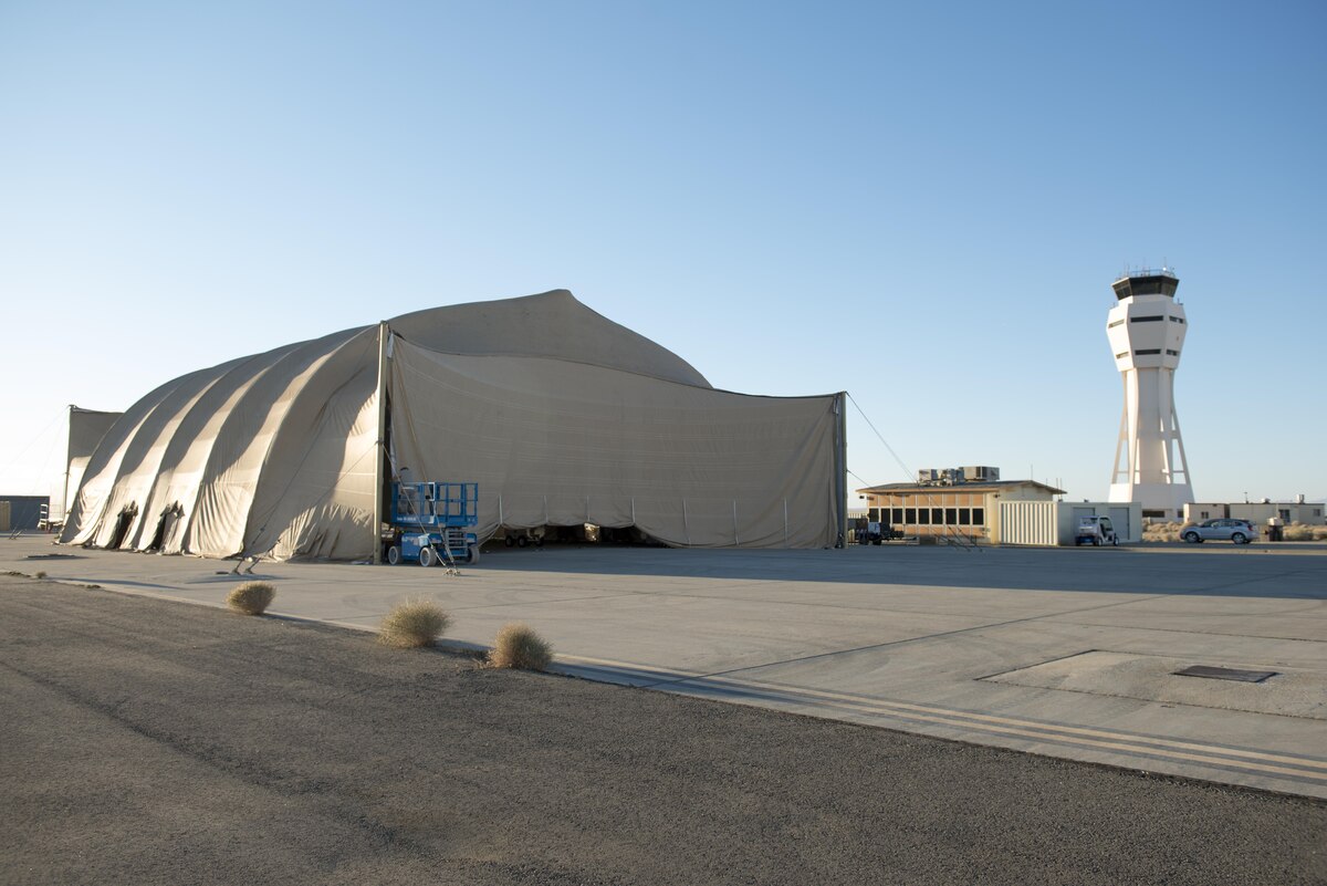 Members of the 461st Flight Test Squadron and Joint Strike Fighter Integrated Test Force have built a decontamination shelter on the flightline to conduct chemical and biological decontamination tests on the F-35 Lightning II. Tests will be toward the end of August. (U.S. Air Force photo by Brad White)