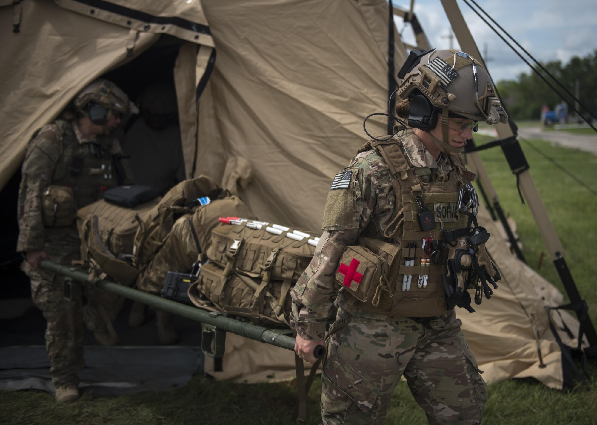 Airmen with the 1st Special Operations Medical Group carry a litter during Task Force Exercise Olympus Archer at Wright Patterson Air Force Base, Ohio, Aug. 17, 2016. Olympus Archer provides training opportunities for more than 230 Air Commandos, with an emphasis on medical and flying operations. (U.S. Air Force photo by Staff Sgt. Christopher Callaway)