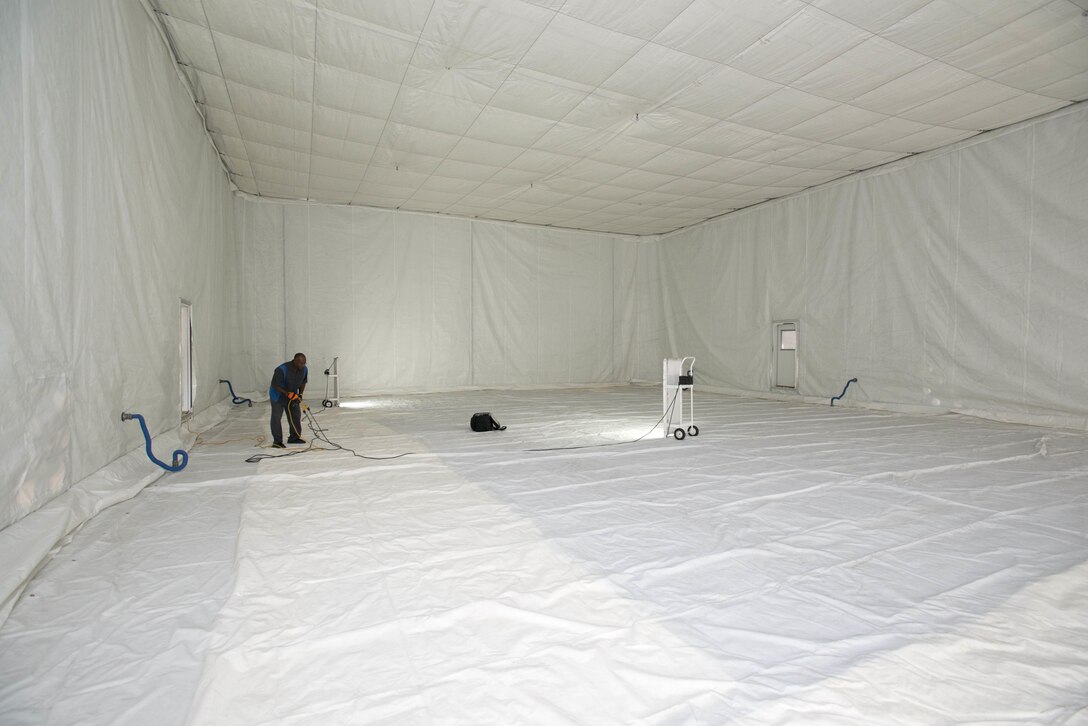 After four weeks, the decontamination shelter is nearing completion and decontamination tests will begin on an F-35A toward the end of August. The inner structure is insulated with heat absorbing panels and a liner to keep high heat inside to decontaminate the jet. (U.S. Air Force photo by Brad White)