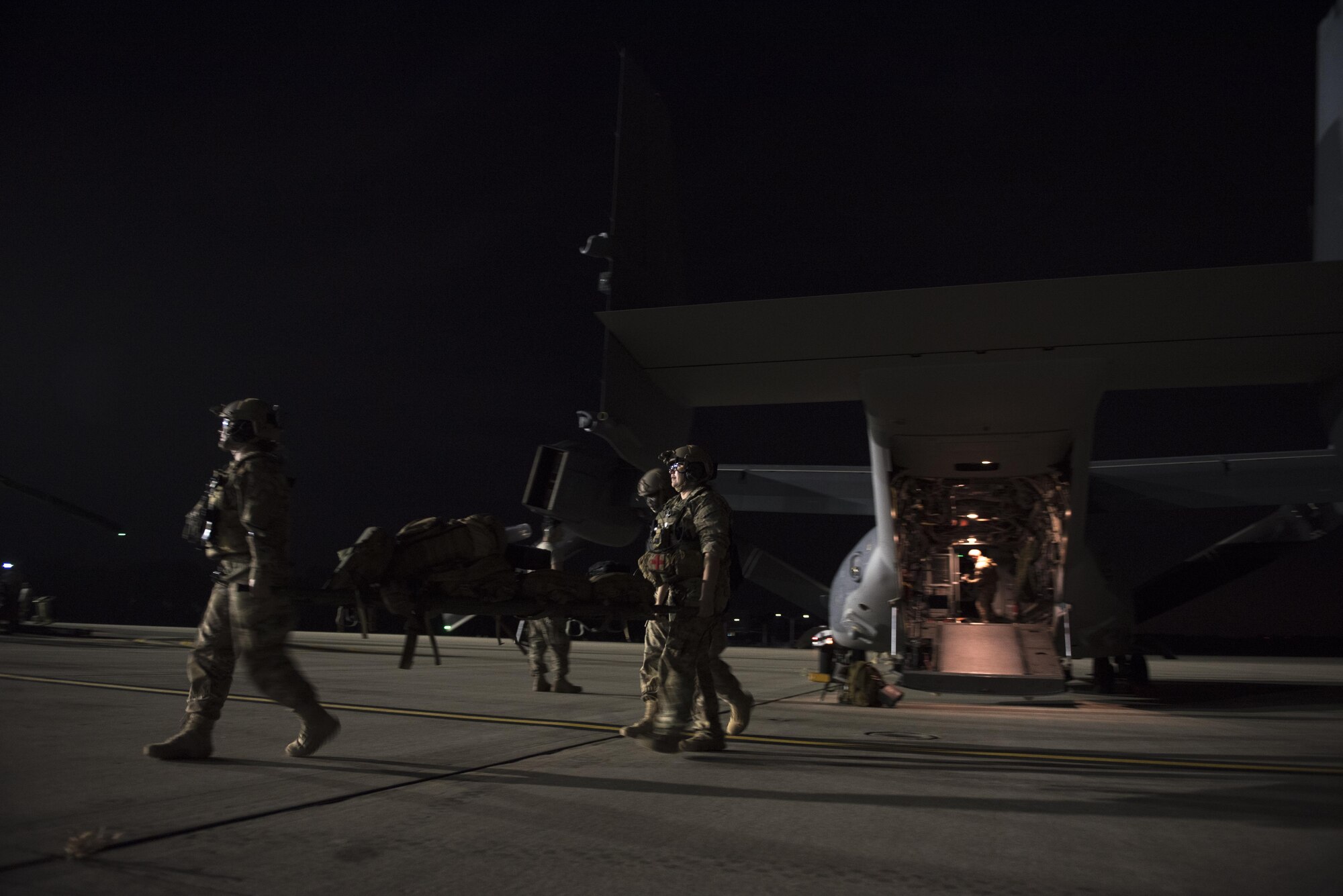 Airmen with the 1st Special Operations Medical Group carry a litter during Task Force Exercise Olympus Archer at Wright Patterson Air Force Base, Ohio, Aug. 17, 2016. Olympus Archer provides training opportunities for more than 230 Air Commandos, with an emphasis on medical and flying operations. (U.S. Air Force photo by Staff Sgt. Christopher Callaway)