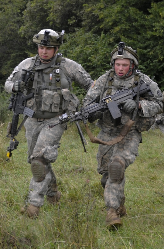 Army Spc. Kyle Herbst, left, a grenadier with Bravo Company, 3rd Battalion, 116th Cavalry Brigade Combat Team, simulates the medical evacuation of an injured soldier during Exercise Saber Guardian 16 at the Romanian Land Forces Combat Training Center in Cincu, Romania, Aug. 2, 2016. Oregon Army National Guard photo by Staff Sgt. Anita VanderMolen