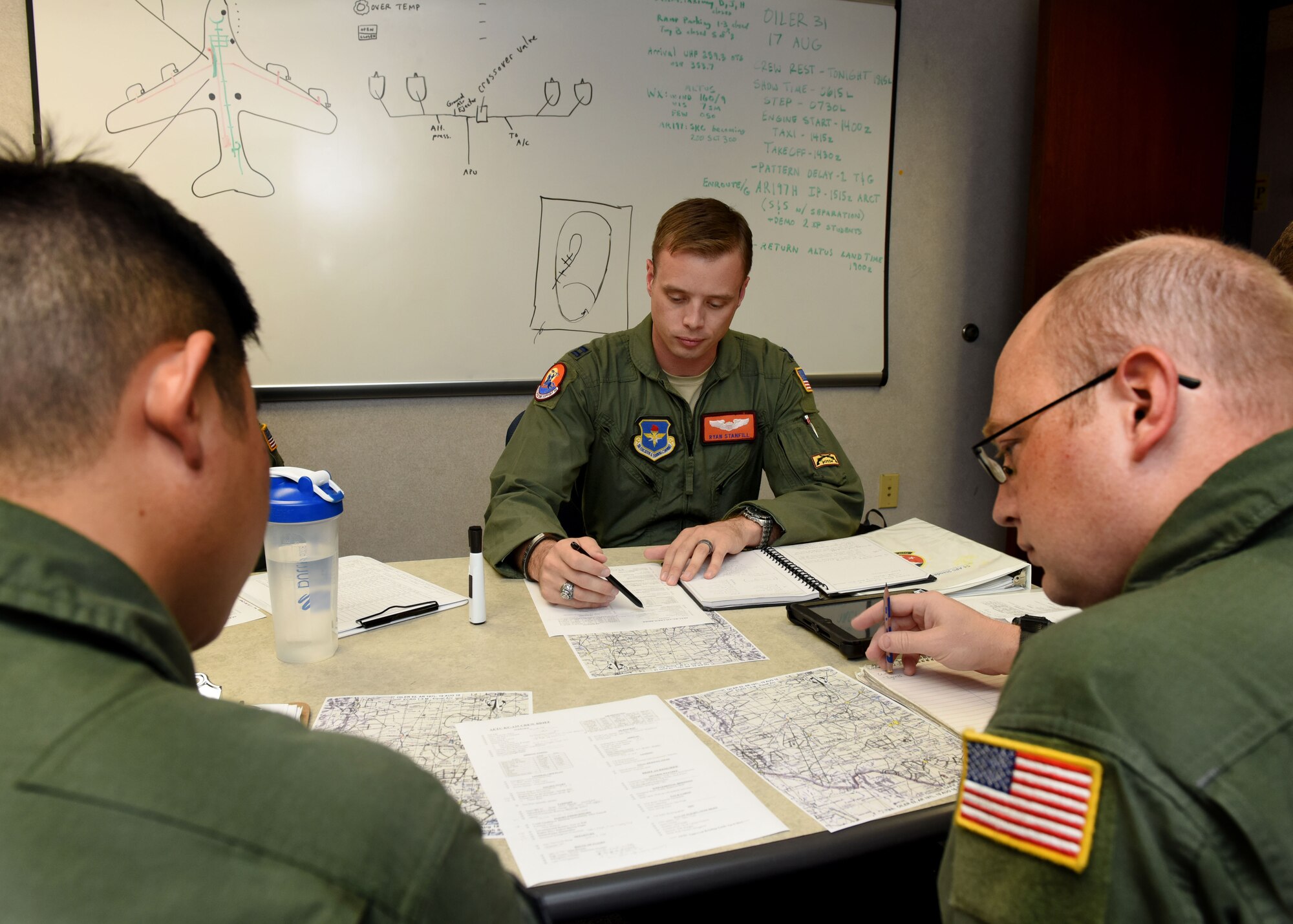 U.S. Air Force Capt. Ryan Stanfill, 97th Operations Support Squadron flight commander, reviews details for a training flight, August 18, 2016, at Altus Air Force Base, Okla. Stanfill attended high school in the City of Altus and is now an instructor pilot for the U.S. Air Force KC-135 Stratotanker refueling aircraft and will soon be one of the first instructor pilots for the new U.S. Air Force KC-46 Pegasus refueling aircraft at Altus AFB. (U.S. Air Force photo by Senior Airman Nathan Clark/Released)