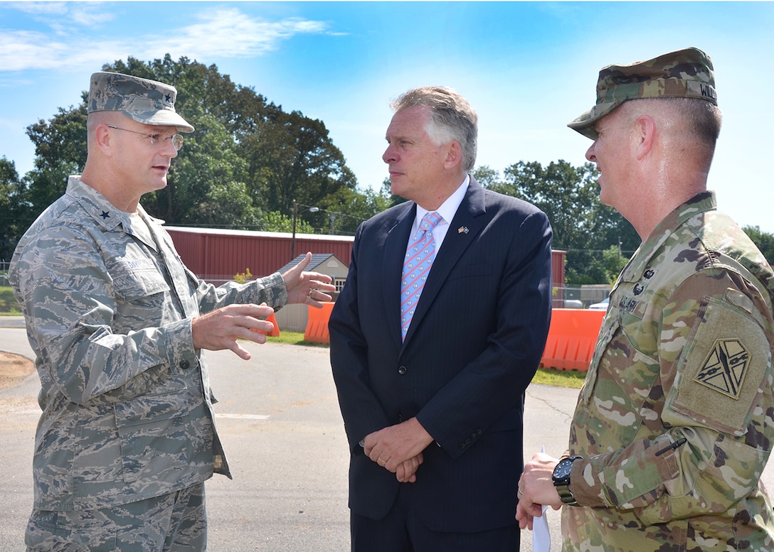 Defense Logistics Agency Aviation and Defense Supply Center Richmond Commander, Air Force Brig. Gen. Allan Day greets Virginia Governor Terry McAuliffe and the Adjutant General of Virginia, Maj. Gen. Timothy Williams to the installation for a ground-breaking ceremony August 17. The Virginia National Guard is set to build a 102,000 square-foot facility on the north side of DSCR. The $30 million project will serve as the National Guard state headquarters.