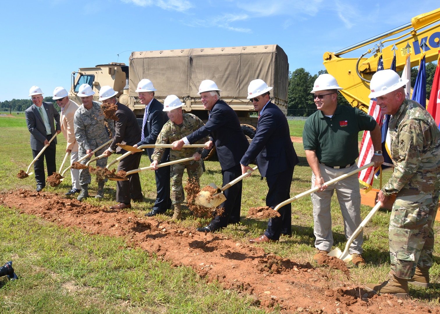 Project partners and organizers ceremoniously break the ground for the Virginia National Guard’s new 102-square-foot headquarters facility on Defense Supply Center Richmond. Among the dirt-turners were Virginia Governor Terry McAuliffe, Maj. Gen. Timothy Williams, the Adjutant General of Virginia and Defense Logistics Agency Aviation and DSCR Commander Air Force Brig. Gen. Allan Day. The building, once completed in February 2018, will be Leadership in Energy and Environmental Design certified Silver. (Photo by Jackie Roberts) 