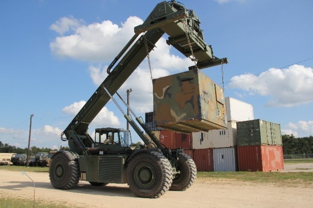 Sgt. 1st Class Gary Gaitan transports a sling-loaded container with the RTCH Kalmar across the CRSP yard during his annual training at Ft. McCoy's Combat Support Training Exercise Aug. 6-26. (Photo by: SPC Aaron Piega/Released)