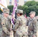 Maj. Gen. Brian C. Lein (left), U.S. Army Medical Department Center and School incoming commander, accepts the colors from Lt. Gen. Nadja Y. West (center), Army Surgeon General and commanding general of U.S. Army Medical Command, as outgoing commander Maj. Gen. Steve Jones (right) looks on at the Fort Sam Houston MacArthur Parade Field Aug. 9.
