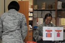 Tech. Sgt. Judith Berry, a pharmacy technician assigned to the 5th Medical Support Squadron, finalizes a prescription for a patient at Minot Air Force Base, N.D., Aug. 17, 2016. The pharmacy provides prescriptions for active duty, retirees and family members. (U.S Air Force photo/Airman 1st Class Jessica Weissman)