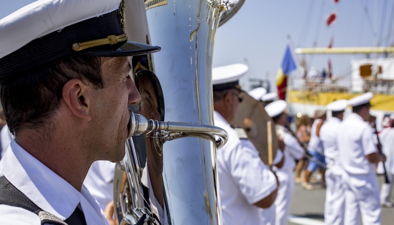 The Romanian Navy Band performs for Romanian citizens, U.S. Marines from the Black Sea Rotational Force, and U.S. soldiers stationed at Mihail Kogălniceanu Air Base on Open Gates Day at the Naval Port of Constanța, Romania, Aug. 6, 2016. Black Sea Rotational Force is an annual multilateral security cooperation activity between the U.S. Marine Corps and partner nations in the Black Sea, Balkan and Caucasus regions designed to enhance participants’ collective professional military capacity, promote regional stability and build enduring relationships with partner nations. (U.S. Marine Corps photo by Lance Cpl. Timothy J. Lutz)