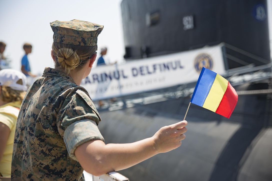 U.S. Marine Corps Cpl. Colleen Moran watches as local Romanians board a submarine during Open Gates Day during a Civilian Affairs engagement on Open Gates Day at the Naval Port of Constanța, Constanța, Romania, Aug. 6, 2016. The BSRF is an annual multilateral security cooperation activity between the U.S. Marine Corps and partner nations in the Black Sea, Balkan and Caucasus regions designed to enhance participants’ collective professional military capacity, promote regional stability and build enduring relationships with partner nations. (U.S. Marine Corps photo by Cpl. Clarence L. Wimberly)