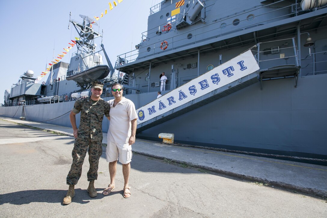 U.S. Marine Corps 1st Lt. Grant Peehler a Civil Affairs planner for the Black Sea Rotational Force poses in front of the Romanian frigate, Mărășești, during a Civilian Affairs engagement on Open Gates Day, two days before the anniversary of the ship's namesake, the Battle of the Mărășești, at the Naval Port of Constanța, Romania, Aug. 6, 2016. Black Sea Rotational Force is an annual multilateral security cooperation activity between the U.S. Marine Corps and partner nations in the Black Sea, Balkan and Caucasus regions designed to enhance participants’ collective professional military capacity, promote regional stability and build enduring relationships with partner nations. (U.S. Marine Corps photo by Cpl. Kyle C. Talbot)
