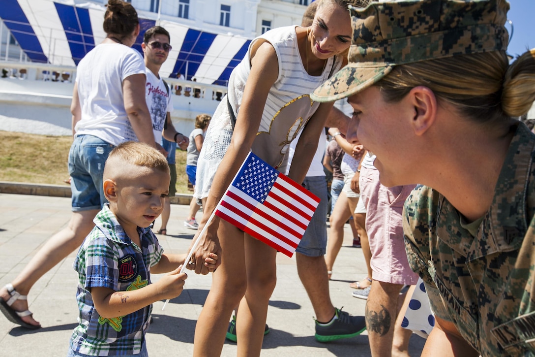 U.S. Marine Corps Cpl. Colleen Moran a U.S. Marine with the Black Sea Rotational Force 16.2 celebrates Romania’s Navy Day with community members in Constanța, Romania, Aug. 15, 2016. Marines from BSRF 16.2 were invited to the ceremony as partners and allies to maintain and strengthen our relationships so we may collectively address common security challenges in the region. Black Sea Rotational Force is an annual multilateral security cooperation activity between the U.S. Marine Corps and partner nations in the Black Sea, Balkan and Caucasus regions designed to enhance participants’ collective professional military capacity, promote regional stability and build enduring relationships with partner nations. (U.S. Marine Corps photo by Cpl. Kyle C. Talbot)
