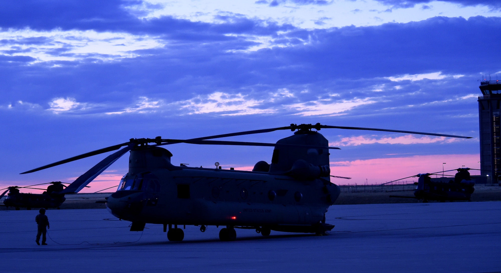 A CH-47 Chinook helicopter sits as the air crew prepares for takeoff to Denver International Airport August 17, 2016, on Buckley Air Force Base, Colo. The air crew and helicopter took part in the annual National Disaster Medical System training exercise, which included transporting patients to and from Denver hospitals. (U.S. Air Force photo by Airman 1st Class Gabrielle Spradling/Released)