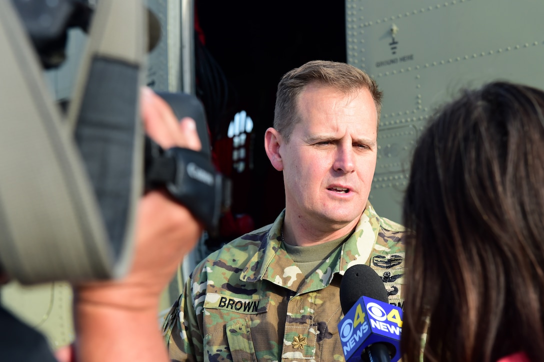 Maj. Troy Brown, Army Aviation Support Facility commander, provides media with an interview during the annual National Disaster Medical System training exercise August 17, 2016, at the Denver International Airport. The exercise brought many organizations, both military and civilian, together to ensure a cohesive relationship. (U.S. Air Force photo by Airman 1st Class Gabrielle Spradling/Released)
