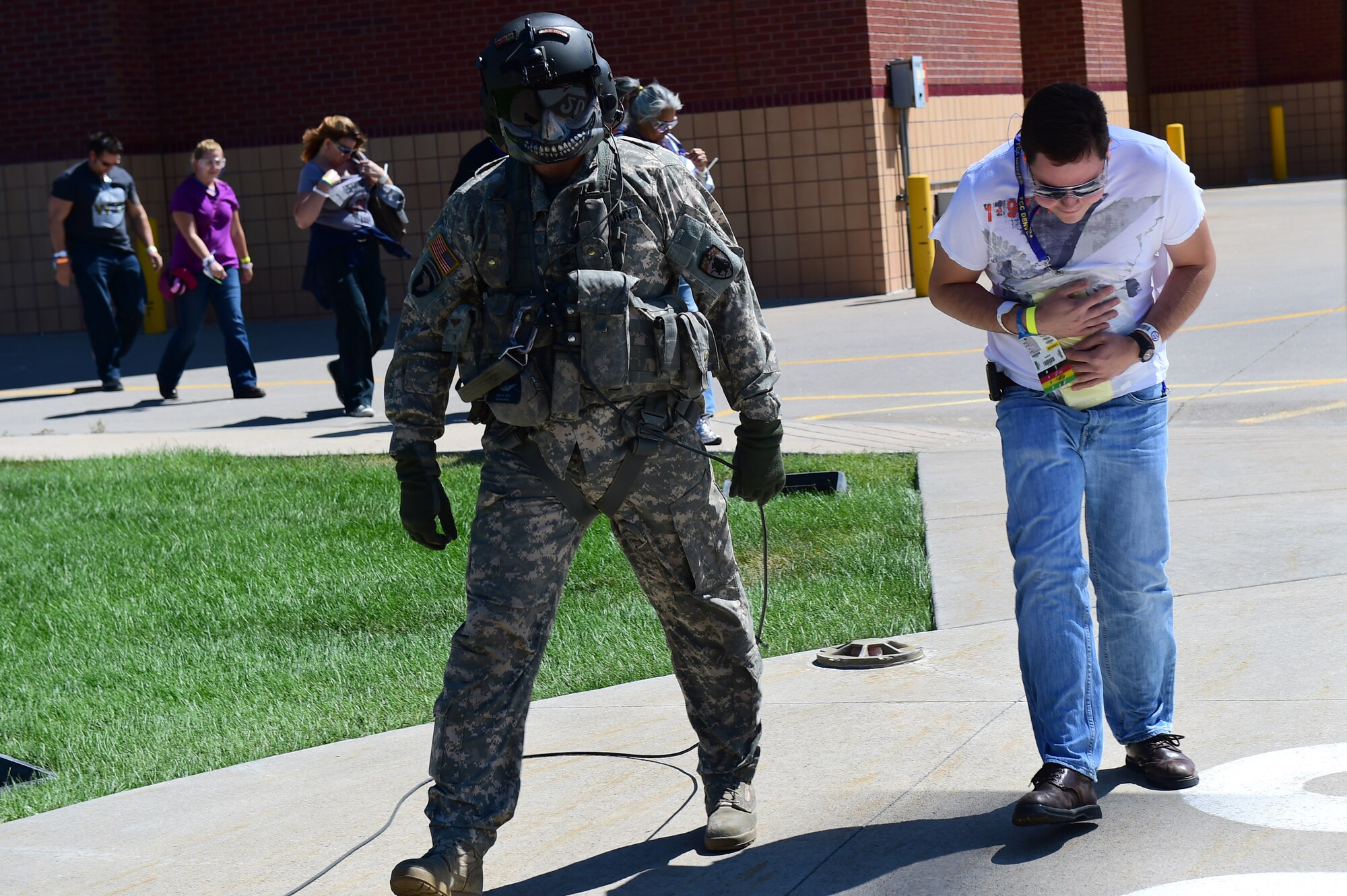 The air crew with a UH-60 Black Hawk helicopter guides patients onto the aircraft during the annual National Disaster Medical System training exercise August 17, 2016, at the Lutheran Medical Center in Wheat Ridge, Colo. The air crews were responsible for facilitating safe landing and take-off procedures, and dropping off and picking up patients from Denver area hospitals. (U.S. Air Force photo by Airman 1st Class Gabrielle Spradling/Released)