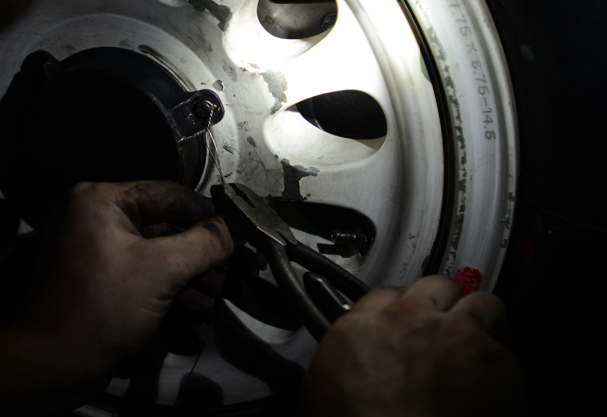 U.S. Air Force Airman 1st Class Tyler Messner, 20th Aircraft Maintenance Squadron tactical aircraft maintainer, changes the tire of an F-16CM Fighting Falcon at Shaw Air Force Base, S.C., Aug. 17, 2016. Depending on the level of wear and tear, maintainers change approximately 200-250 tires per month. (U.S. Air Force photo by Airman 1st Class Kelsey Tucker)