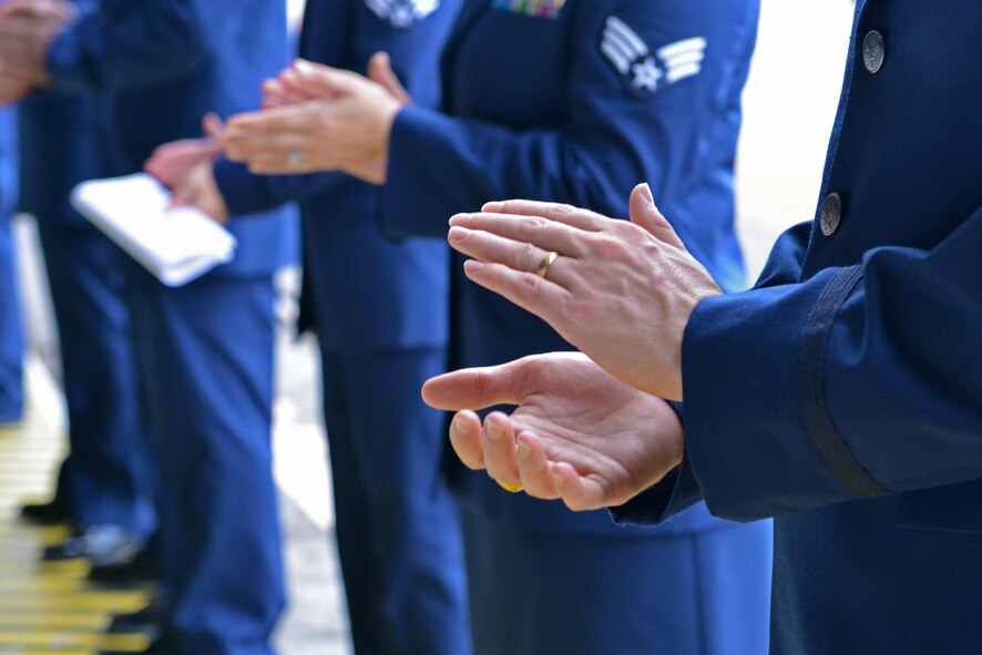 U.S. Airmen assigned to the 20th Fighter Wing applaud during a 20th FW change of command ceremony at Shaw Air Force Base, S.C., Aug. 19, 2016. During the change of command ceremony, Col. Daniel Lasica assumed command of the 20th FW from Col. Stephen Jost. As commander of the 20th FW, Lasica will lead the wing in its mission of maintaining readiness to deploy and employ combat forces in support of operational wartime requirements worldwide. (U.S. Air Force photo by Airman 1st Class Destinee Sweeney)