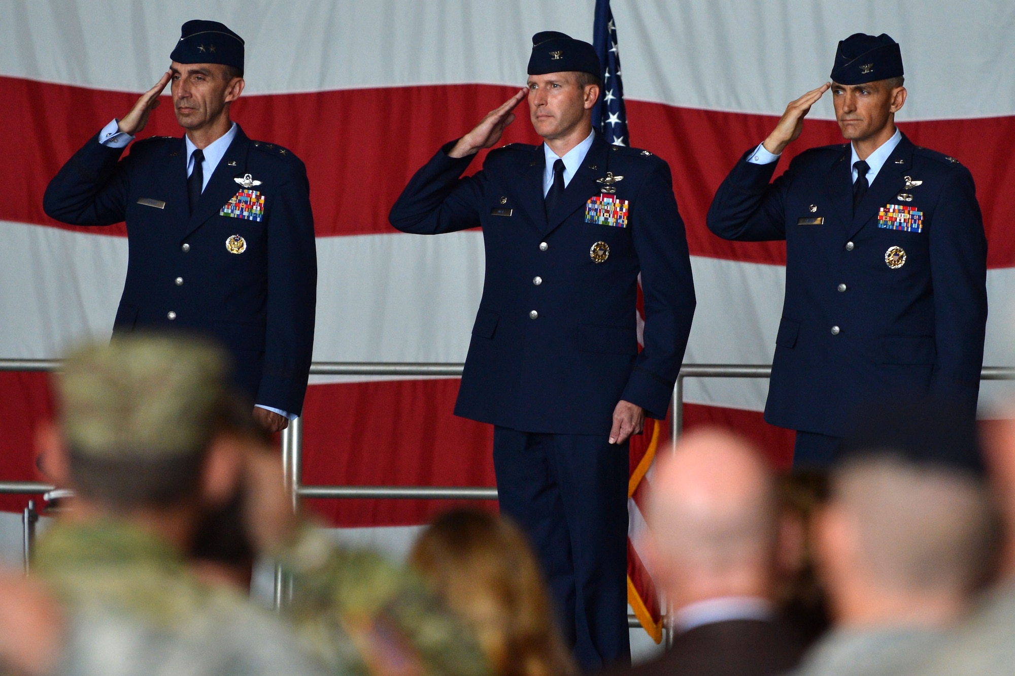 (From left) U.S. Air Force Maj. Gen. Scott Zobrist, 9th Air Force commander, Col. Stephen Jost, outgoing 20th Fighter Wing commander, and Col. Daniel Lasica, incoming 20th FW commander, salute at Shaw Air Force Base, S.C., Aug. 19, 2016. As commander of the 20th FW, Lasica will lead the wing in its mission of maintaining readiness to deploy and employ combat forces in support of operational wartime requirements worldwide. (U.S. Air Force photo by Senior Airman Michael Cossaboom)