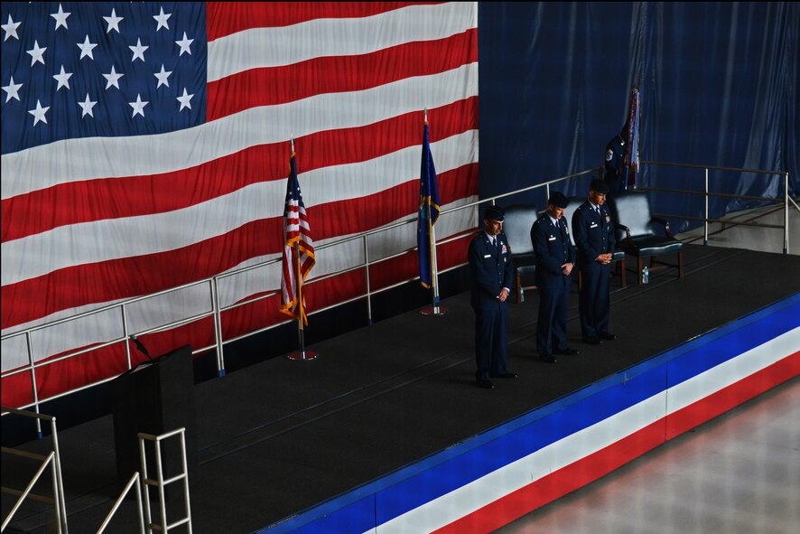 (From left) U.S. Air Force Maj. Gen. Scott Zobrist, 9th Air Force commander, Col. Stephen Jost, outgoing 20th Fighter Wing commander, and Col. Daniel Lasica, incoming 20th FW commander, bow their heads for an invocation during a 20th FW change of command ceremony at Shaw Air Force Base, S.C., Aug. 19, 2016. Lasica, a command pilot with more than 3,800 flight hours, serves as the senior officer responsible for the organization, training, and equipping of an 18-squadron wing including three F-16CM fighter squadrons, 17 wing staff agencies, and the health and welfare of 7,886 active-duty Airmen, Soldiers, civilians, and more than 8,000 family members. (U.S. Air Force photo by Airman 1st Class Destinee Sweeney)