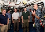POLARIS POINT, Guam (Aug. 16, 2016) Lt. Bradley Newsad, the Command Judge Advocate and Public Affairs Officer aboard the submarine tender USS Emory S. Land (AS 39), describes a repair locker and its uses to personnel staff from the House Armed Services Committee during a tour of the Emory S. Land. Emory S. Land, homeported in Guam, conducts maintenance on surface ships and submarines in the U.S. 5th and 7th Fleet areas of operations. (U.S. Navy photo by Mass Communication Specialist Seaman Daniel S. Willoughby)

