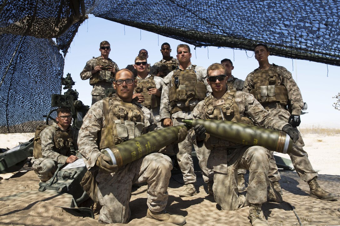 Marines with Battery I, 3rd Battalion, 12th Marine Regiment attached to 1st Battalion Regiment, 11th Marine Division pose in front of a M777A2 Howitzer during Large Scale Exercise 2016 at Marine Corps Air-Ground Combat Center Twentynine Palms, Calif., Aug. 16, 2016. LSE-16 simulates the planning, deployment and combat operations of a cohesive, combat-ready team consisting of more than 50,000 military members with I Marine Expeditionary Force. (U.S. Marine Corps photo by Sgt. Abbey Perria)