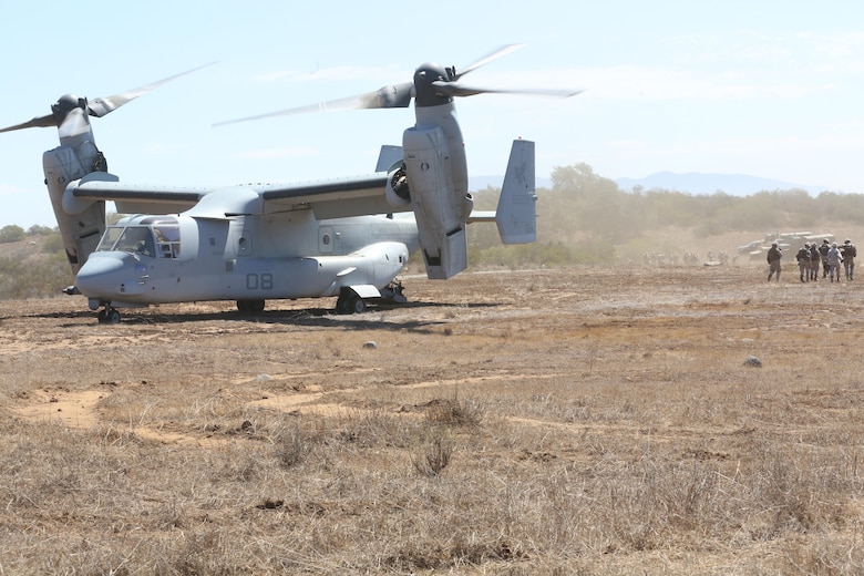 Marines from 5th Battalion, 11th Marine Regiment, walk away from an MV-22B Osprey during a casualty evacuation exercise aboard Marine Corps Base Camp Pendleton, Calif., Aug. 17. Marine Medium Tiltrotor Squadron 161 supported 5th Battalion, 11th Marines, in order to increase proficiency in conducting CAS EVACS. (U.S. Marine Corps photo by Pfc. Jake M. T. McClung/Released)