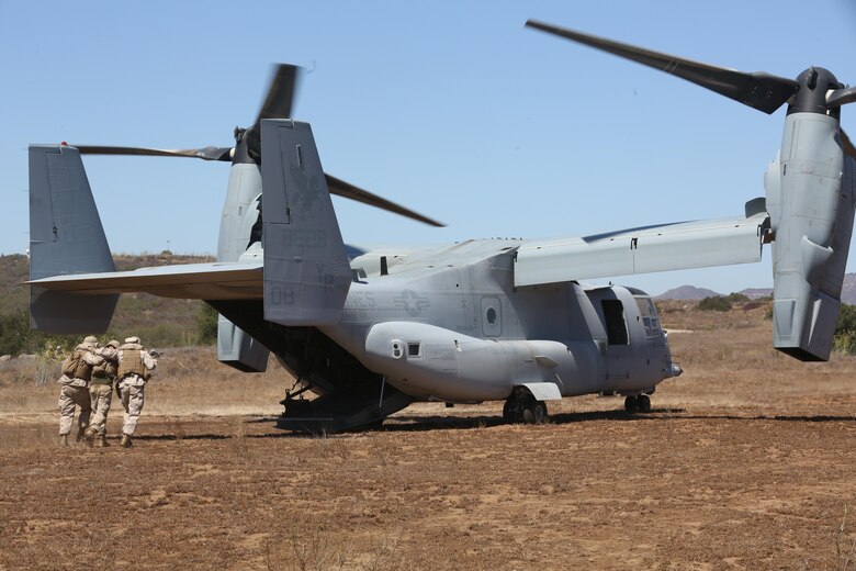 Marines with 5th Battalion, 11th Marine Regiement, assist a simulated casualty onto an MV-22B Osprey during a casualty evacuation exercise aboard Marine Corps Base Camp Pendleton, Calif., Aug. 17. Marine Medium Tiltrotor Squadron (VMM) 161 supported 5th Battalion, 11th Marines, in order to increase proficiency in conducting CAS EVACS. (U.S. Marine Corps photo by Pfc. Jake M. T. McClung/Released)