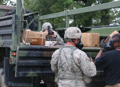 MUSCATATUCK URBAN TRAINING CENTER, Ind. - Army Reserve Public Affairs Soldier, Spc. Logan Rath, provides media coverage for Soldiers of the 101st Airborne Division, as they conduct Chemical Biological Radiological, and Nuclear training, on August 14th, 2016. (U.S. Army Reserve photo by Sgt. Michael Adetula, U.S. Army Reserve/Released)