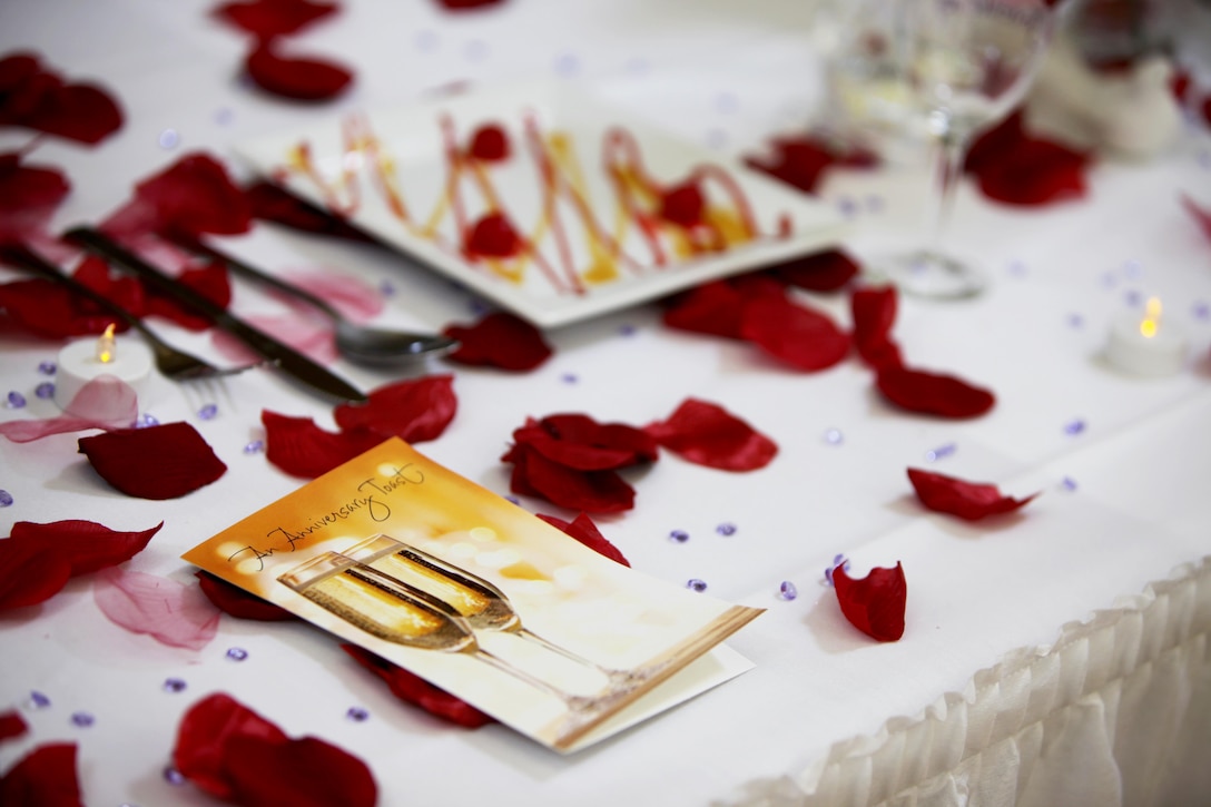 A wedding-themed display sets the tone for a Cpl. Marisela Olibares’ culinary product during the Headquarters and Headquarters Squadron’s Chef of the Quarter Competition at Marine Corps Air Station Cherry Point, N.C., Aug. 18, 2016. The quarterly competition tests food service specialists on the taste of their food, plate display, table appearance and culinary knowledge based on the anniversary theme they were given. Olibares is a food service specialist with H&HS(U.S. Marine Corps photo by Cpl. Jason Jimenez/Released)