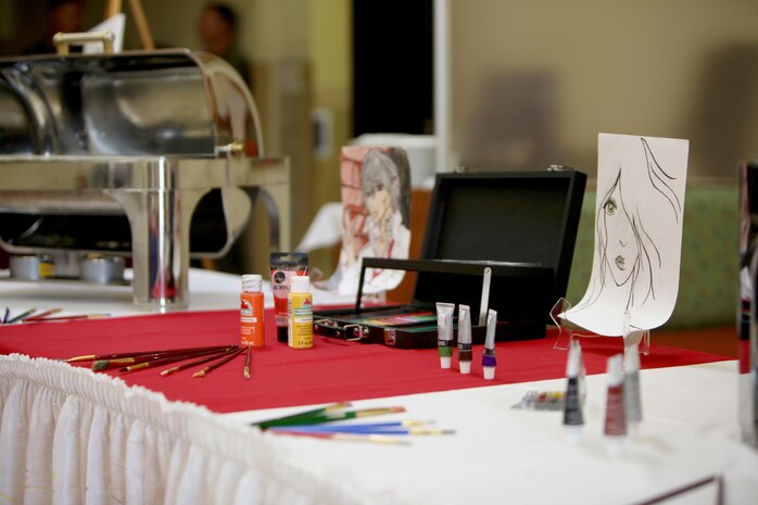 An artist-themed display created by Sgt. Theius Dalton sets the tone for his culinary products during the Headquarters and Headquarters Squadron’s Chef of the Quarter Competition aboard Marine Corps Air Station Cherry Point, N.C., Aug. 18, 2016. The quarterly competition tests food service specialists on the taste of their food, plate display, table appearance and culinary knowledge based on the anniversary theme they were given. Dalton is a food service specialist with H&HS (U.S. Marine Corps photo by Cpl. Jason Jimenez/Released)