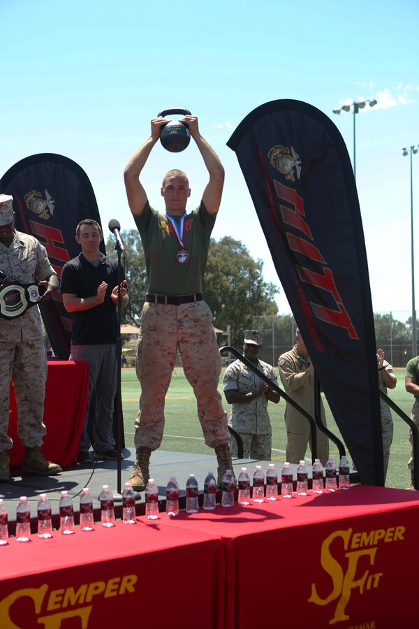 Cpl. Ethan Mawhinney, the top male competitor of the Tactical Athlete Championship, holds his trophy up during an awards ceremony aboard Marine Corps Air Station Miramar, Calif., Aug. 18. The competition was a part of the Marine Corps’ High Intensity Tactical Training program and tested the strengths and abilities of Marines from different installations around the Corps. (U.S. Marine Corps photo by Pfc. Liah Kitchen/Released)