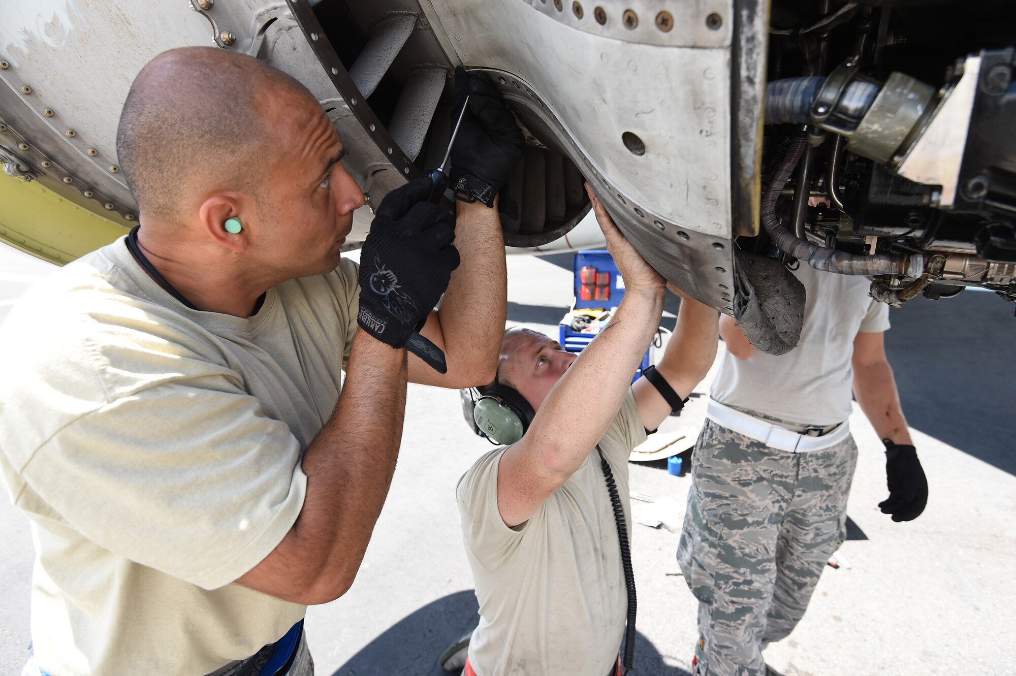 Master Sgt. Omar Torres, left, from the 513th Maintenance Squadron, and Staff Sgt. Austin Paisley, right, from the 552nd Aircraft Maintenance Squadron, remove an engine part from an E-3 Sentry on July 25, 2016, at Joint Base Pearl Harbor-Hickam, Hawaii. More than 125 Airmen from the 513th Air Control Group and 552nd Air Control Wing are deployed to Hawaii in support of the Rim of the Pacific 2016 exercise. Twenty-six nations, more than 40 ships and submarines, more than 200 aircraft and 25,000 personnel are participating in RIMPAC from June 30 to Aug. 4, in and around the Hawaiian Islands and Southern California. The world's largest international maritime exercise, RIMPAC provides a unique training opportunity that helps participants foster and sustain the cooperative relationships that are critical to ensuring the safety of sea lanes and security on the world's oceans. RIMPAC 2016 is the 25th exercise in the series that began in 1971. (U.S. Air Force photo by 2nd Lt. Caleb Wanzer)