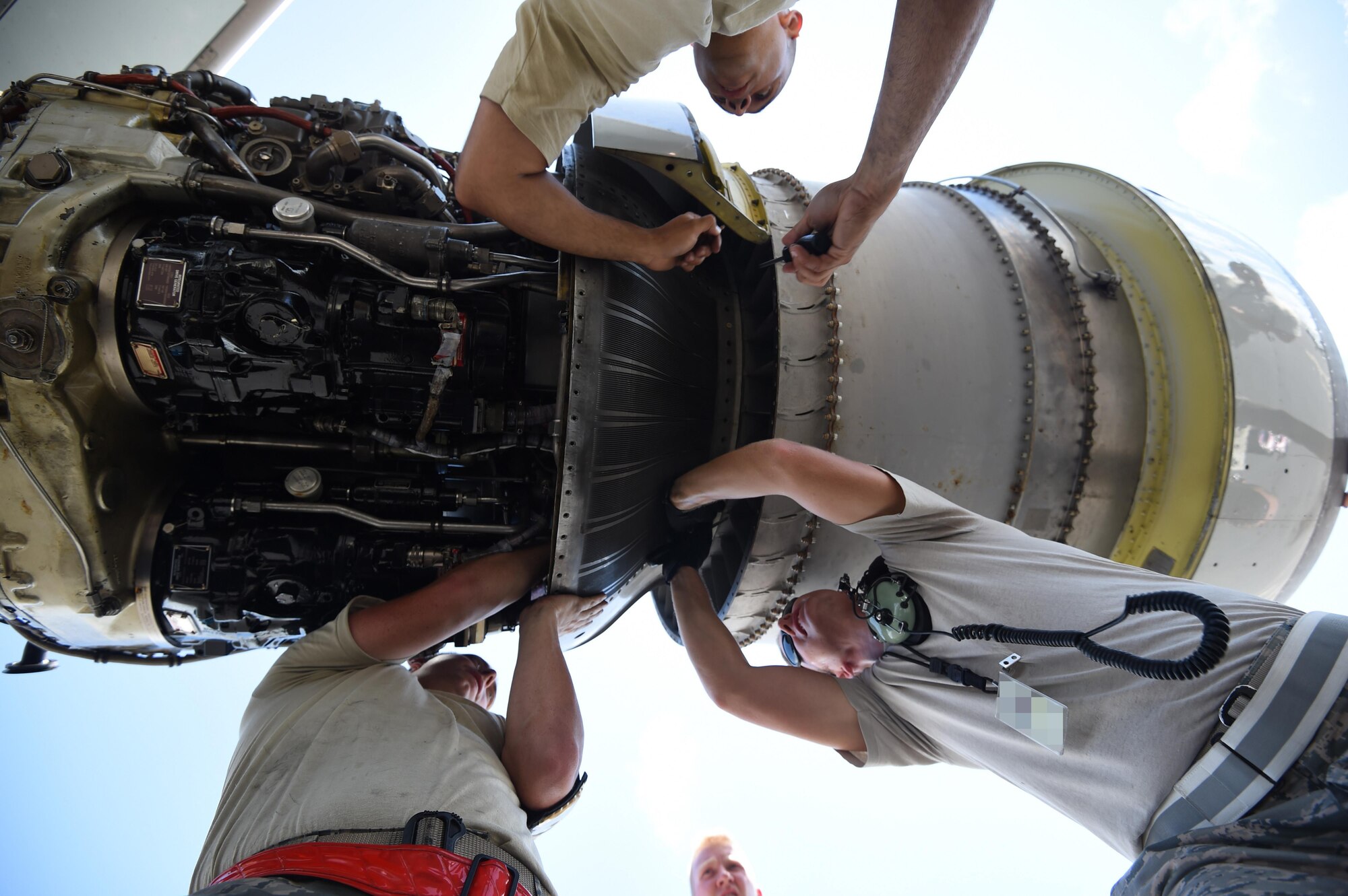 Maintenance Airmen from the 513th Air Control Group and 552nd Air Control Wing replace an engine part on an E-3 Sentry on July 25, 2016, at Joint Base Pearl Harbor-Hickam, Hawaii. More than 125 Airmen from the 513th Air Control Group and 552nd Air Control Wing are deployed to Hawaii in support of the Rim of the Pacific 2016 exercise. Twenty-six nations, more than 40 ships and submarines, more than 200 aircraft and 25,000 personnel are participating in RIMPAC from June 30 to Aug. 4, in and around the Hawaiian Islands and Southern California. The world's largest international maritime exercise, RIMPAC provides a unique training opportunity that helps participants foster and sustain the cooperative relationships that are critical to ensuring the safety of sea lanes and security on the world's oceans. RIMPAC 2016 is the 25th exercise in the series that began in 1971. (U.S. Air Force photo by 2nd Lt. Caleb Wanzer)