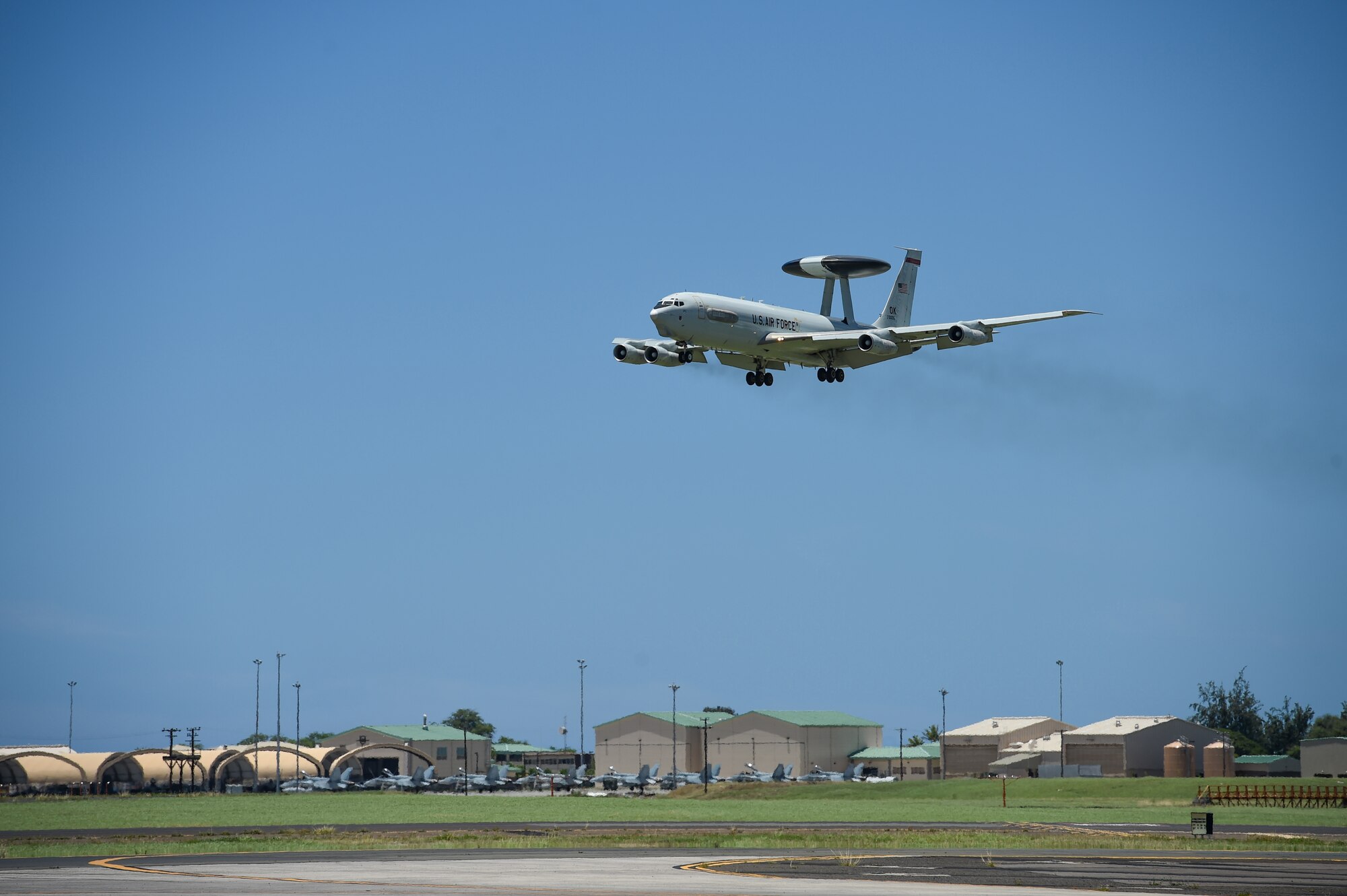 An E-3 Sentry Airborne Warning and Control System aircraft flown by Airmen from the 965th Airborne Air Control Squadron prepares to land on July 25, 2016, at Joint Base Pearl Harbor-Hickam, Hawaii. More than 125 Airmen from the 513th Air Control Group and 552nd Air Control Wing are deployed to Hawaii in support of the Rim of the Pacific 2016 exercise. Twenty-six nations, more than 40 ships and submarines, more than 200 aircraft and 25,000 personnel are participating in RIMPAC from June 30 to Aug. 4, in and around the Hawaiian Islands and Southern California. The world's largest international maritime exercise, RIMPAC provides a unique training opportunity that helps participants foster and sustain the cooperative relationships that are critical to ensuring the safety of sea lanes and security on the world's oceans. RIMPAC 2016 is the 25th exercise in the series that began in 1971. (U.S. Air Force photo by 2nd Lt. Caleb Wanzer)
